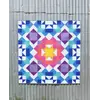 Aurora Quilt Pattern by Tied With A Ribbon - Quilt hung on corregated iron for effect