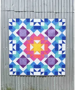 Aurora Quilt Pattern by Tied With A Ribbon - Quilt hung on corregated iron for effect