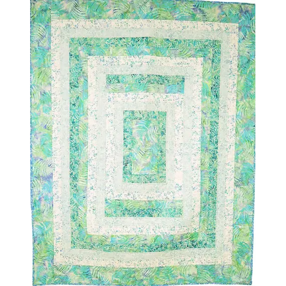 Seeing Double Reversible Throw Quilts Bag Pattern by Aunties Two - completed quilt in green and white