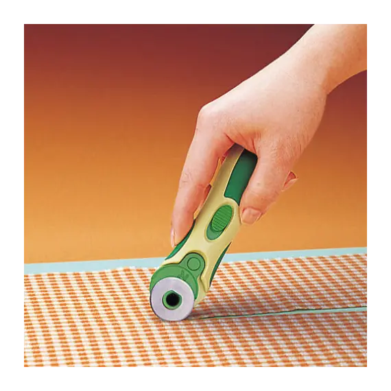 Clover 28mm Blades for Rotary Cutter 5 Pieces - image of 28mm rotary cutter in use